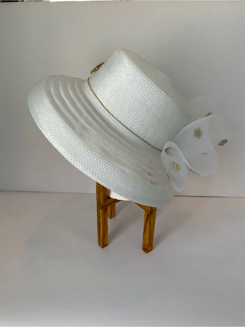 Elegant White Wide-Brim Church Hat with Net Lace Bow and Gold Floral Accent